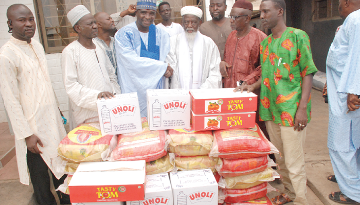 Mr Kamal-deen Abdulai (2nd left), the National Nasara Co-ordinator of the NPP, presenting the food items to Dr Sheikh Nuhu Sharubutu (3rd right), the National Chief Imam. Others in the picture are some officials of the NPP and the Chief Imam’s office